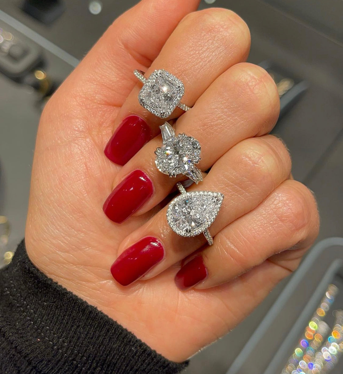 three diamond rings on fingers