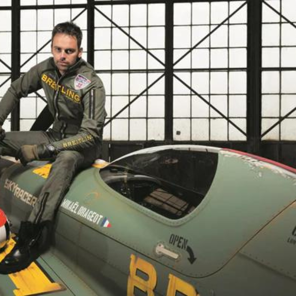 Pilot sitting on Breitling airplane