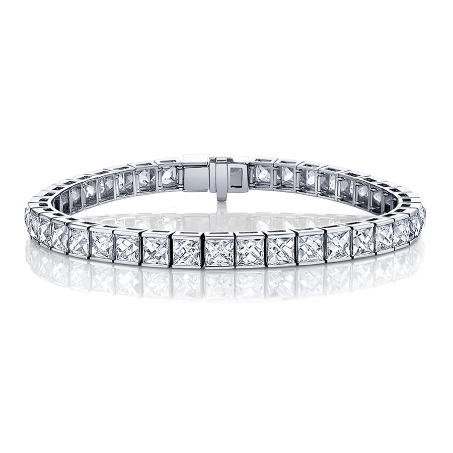 A platinum tennis bracelet featuring a series of square diamonds.