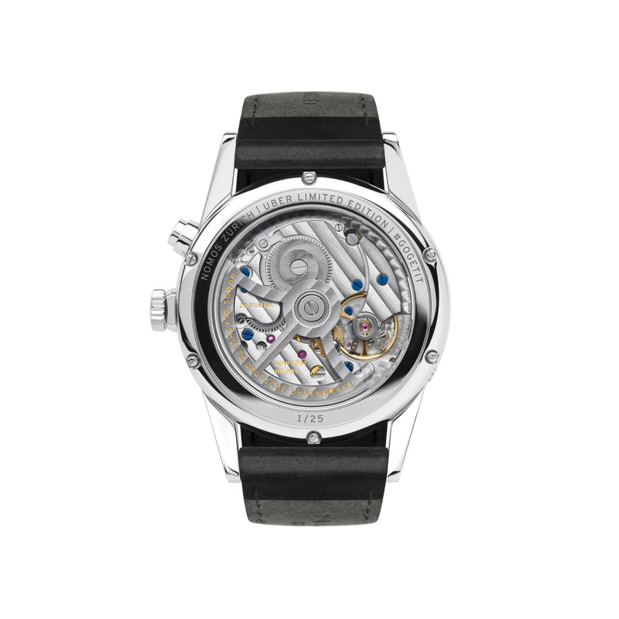 Watch with black strap and visible mechanical components on a white background