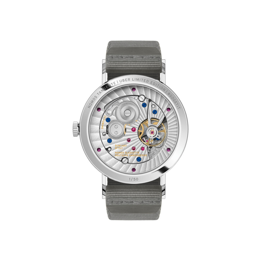 Watch with visible mechanical components on a white background