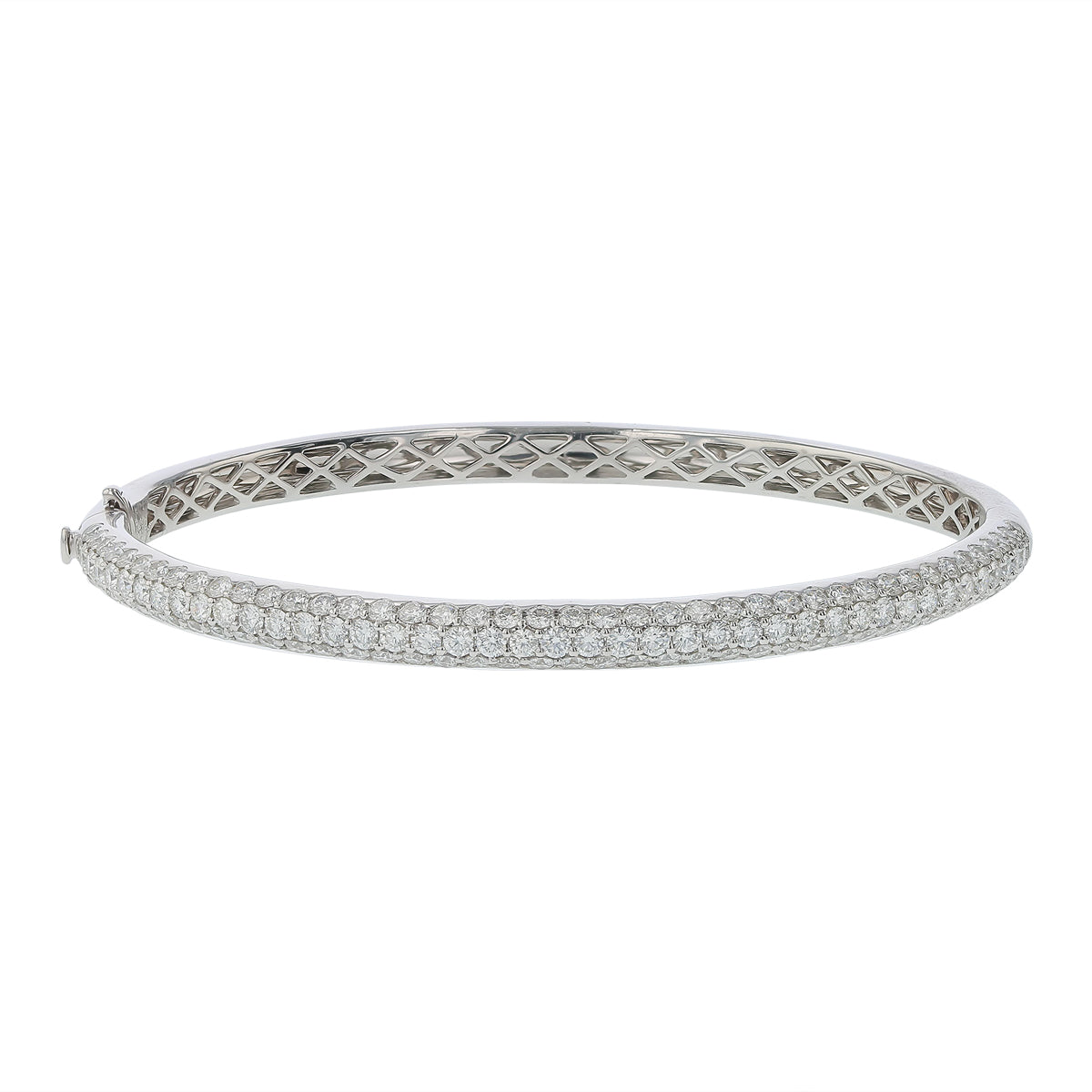 a white gold bangle bracelet encrusted with diamonds.