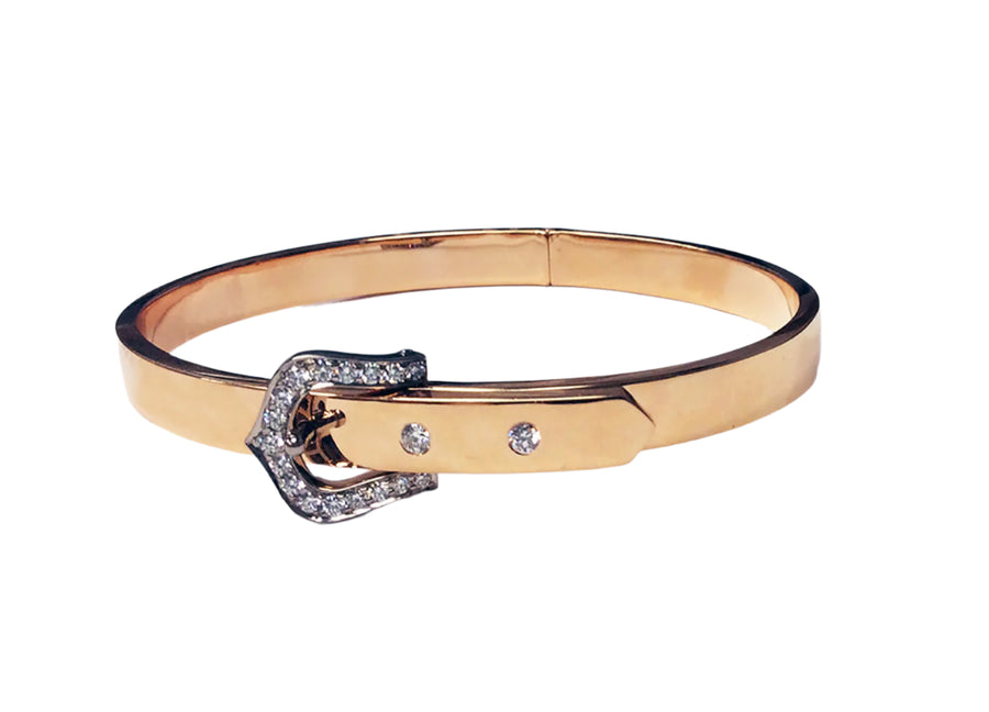 Gold bracelet with a buckle design on a white background