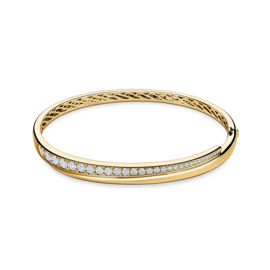 Gold bracelet with diamond accents on a white background